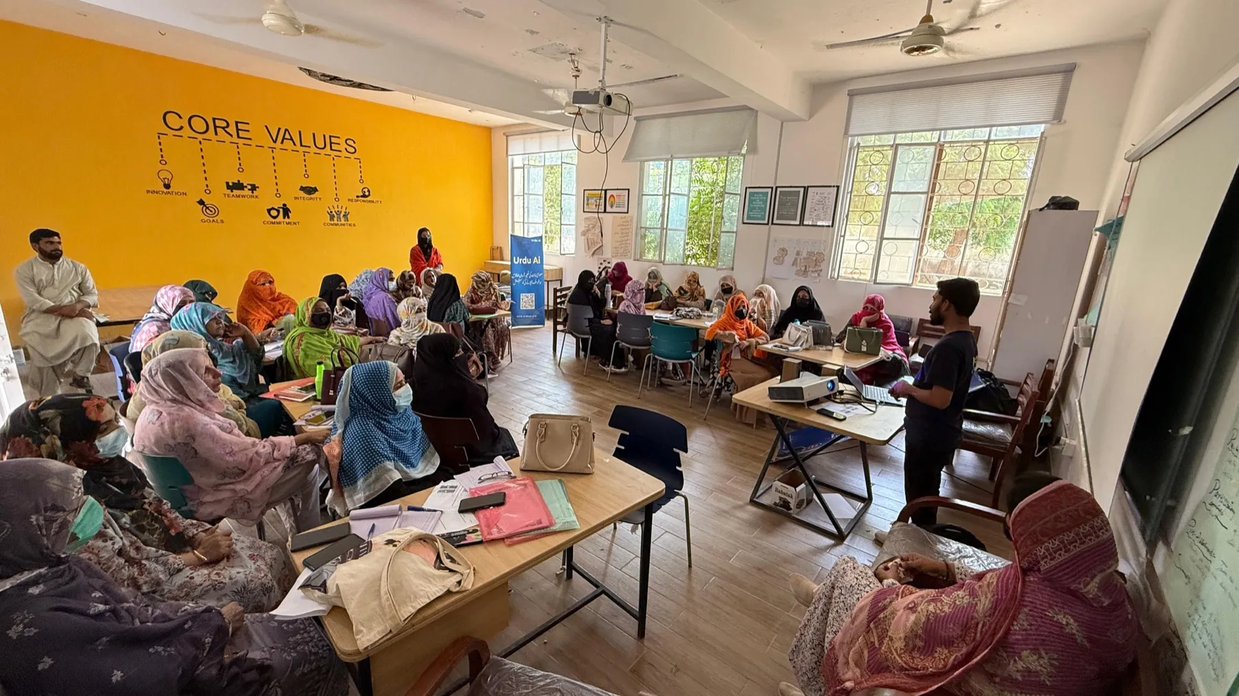 Women participating in an Urdu Ai community workshop