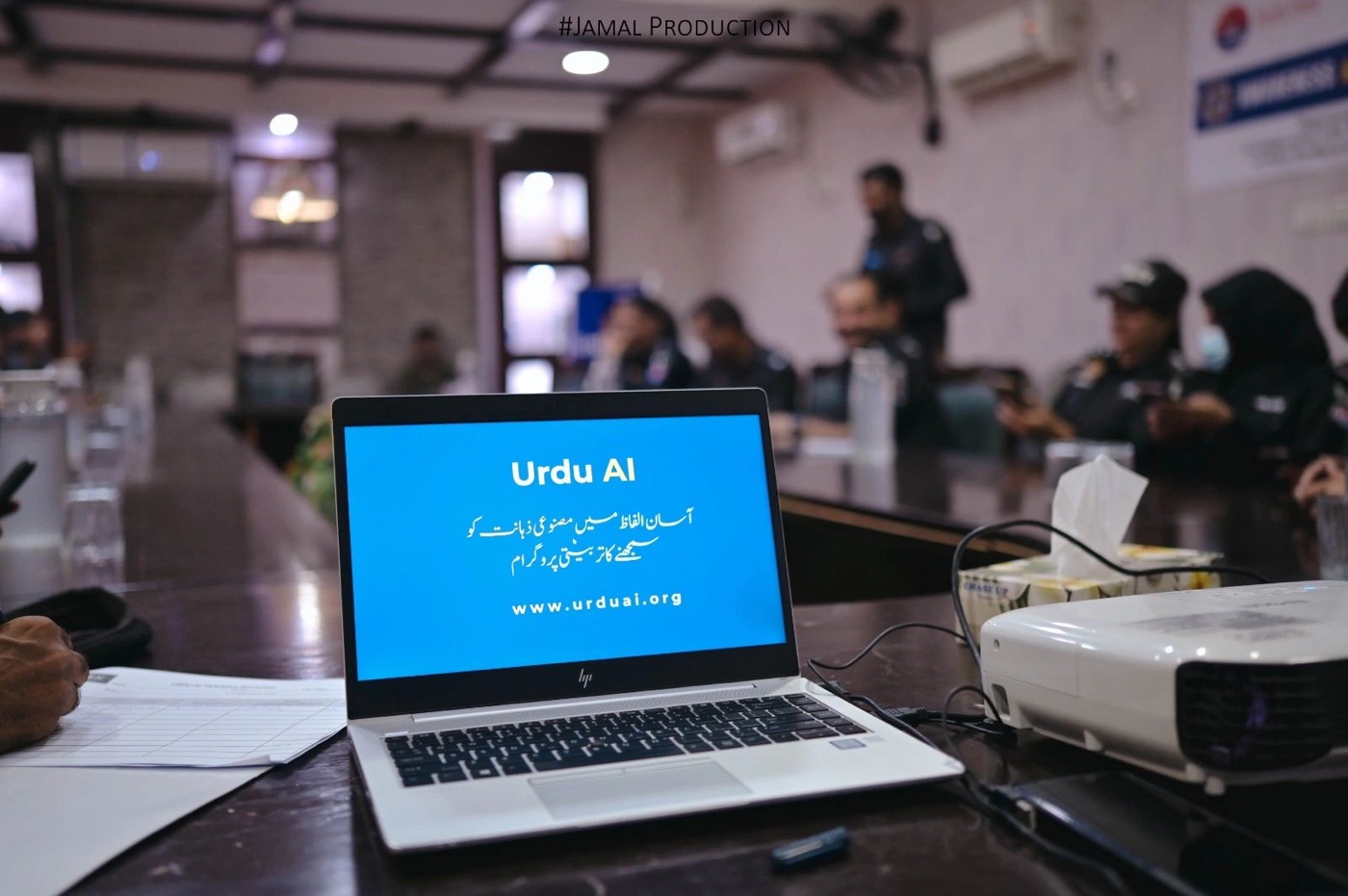 Urdu Ai presentation shown on a laptop during public-sector AI training